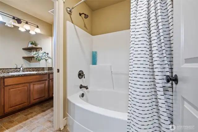 Separate tub/shower opens to the hall for added convenience.