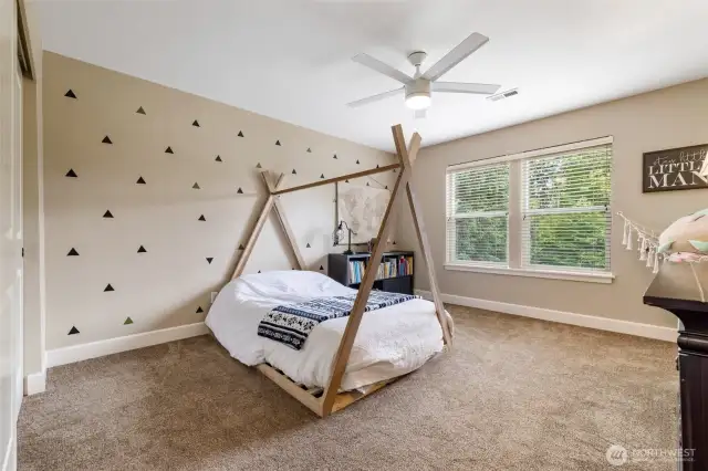 The first of two spacious bedrooms. Both are sunny and bright with ceiling fans, spacious closets and cozy wall-to-wall carpeting.