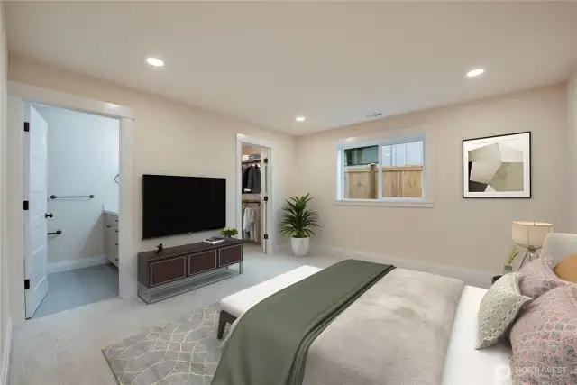 Primary bedroom with en-suite bath and walk-in closet **Virtually staged