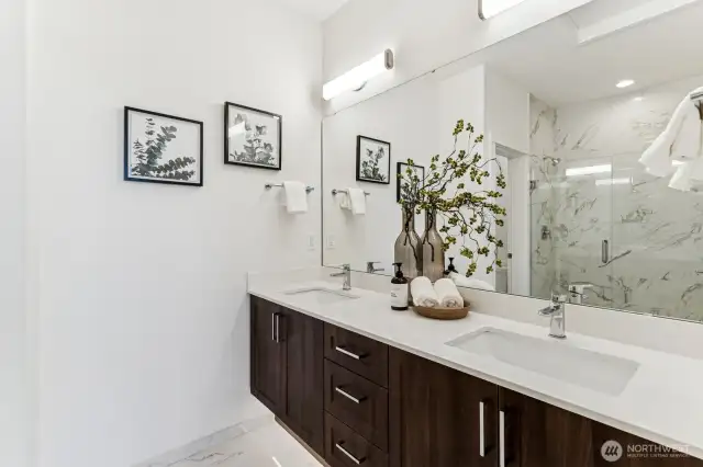Spa-like bathroom with floating cabinets and undercounter lighting.