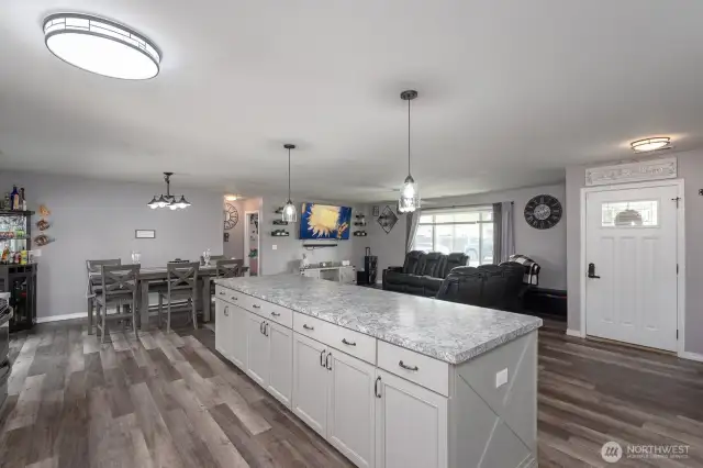 Kitchen looking to dining and living area