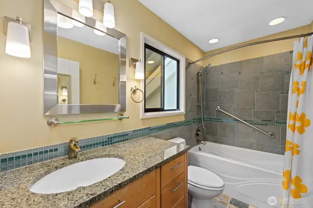 Remodeled Bath in the Primary Suite with Tile finishes and heated floors.
