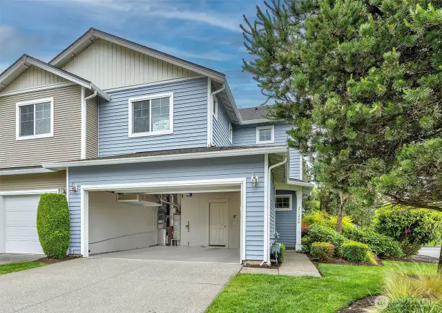 Spacious two car garage with two additional driveway spots.