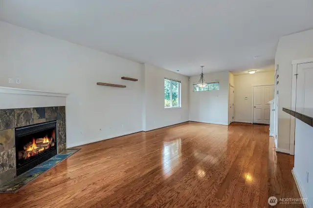 Dining and living area with a slate gas fireplace.