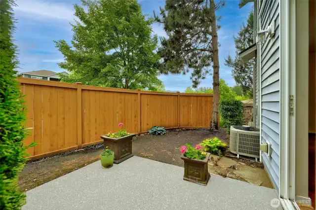 Step out to a private, fenced patio and small yard.