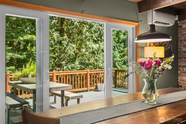 Large glass two door slider lets in tons of light and leads to the large trex style deck.