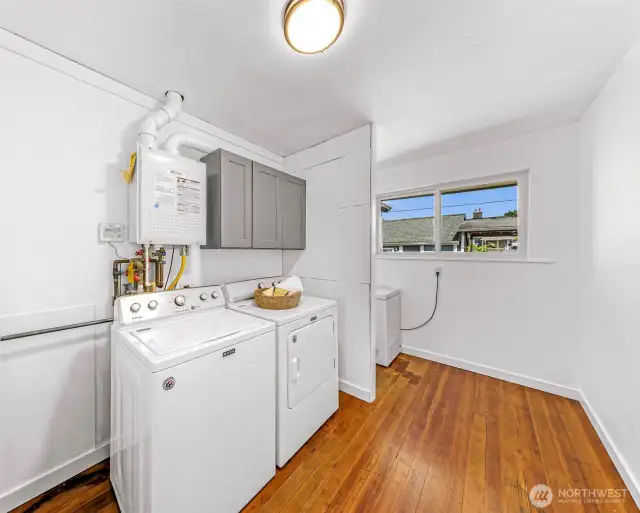 Large Laundry room with additional space that could be a great future half bath.