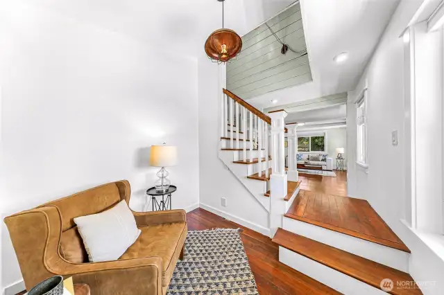 Bonus space on the other side of the stairs makes a great playroom, office or add shelves up the vaulted ceiling and have your own mini library!