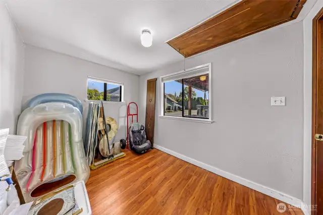 Bedroom space off of living room in shop.