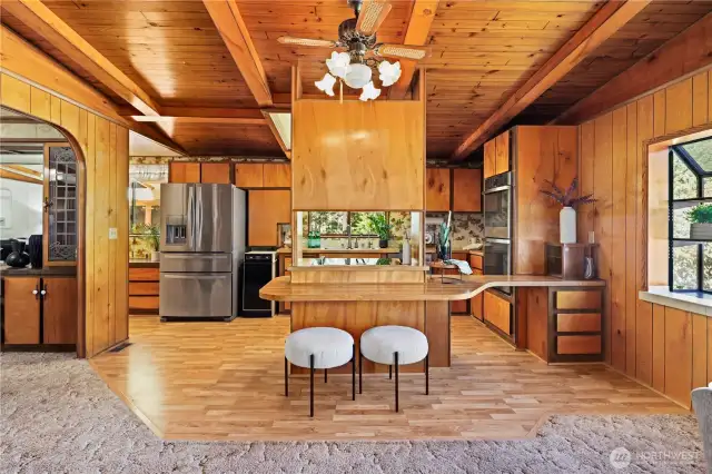 Kitchen with breakfast bar seating.