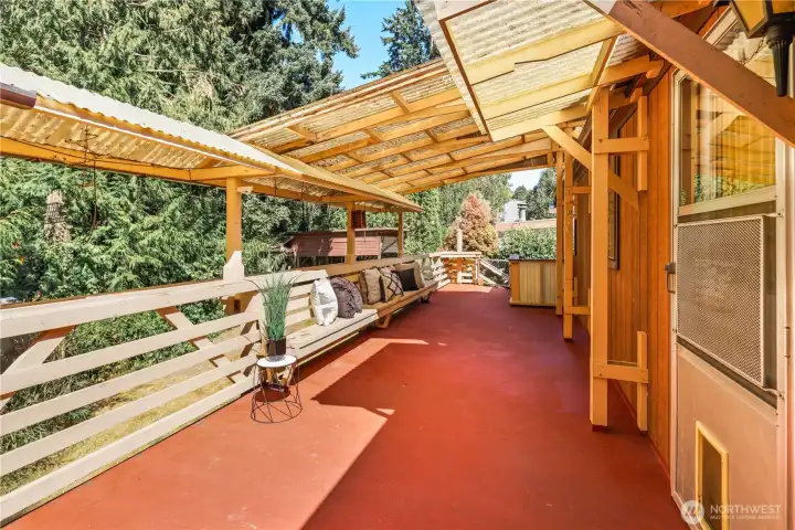 Huge deck partially covered plus awning.