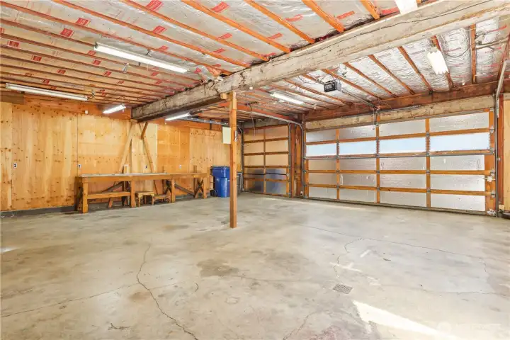 3 car garage with work benches ready for your hobbies.
