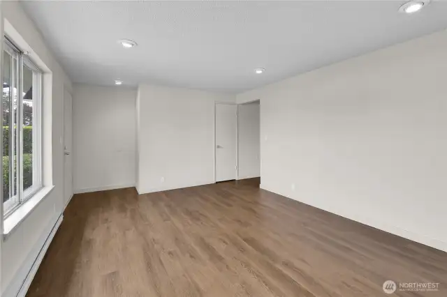 Living room opening from entry to hallway