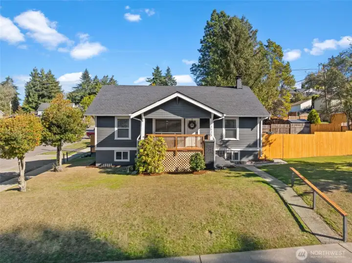This beautiful Craftsman home sits perched up high on a corner lot with views of the Port & City