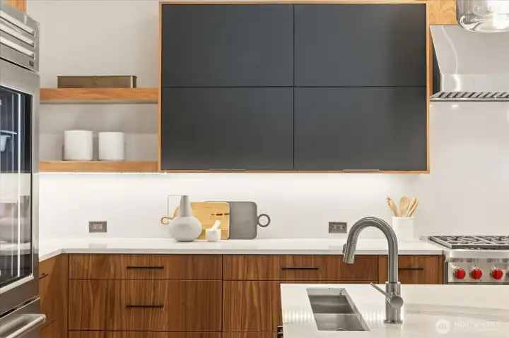 Walnut cabinetry Belmont Cabinet 1900 Series showcased.  Vegetable/Ice  sink shown on island.