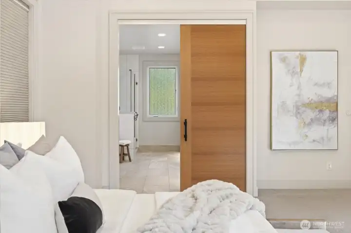 Sliding door from Primary to bath adds posh to the ensuite