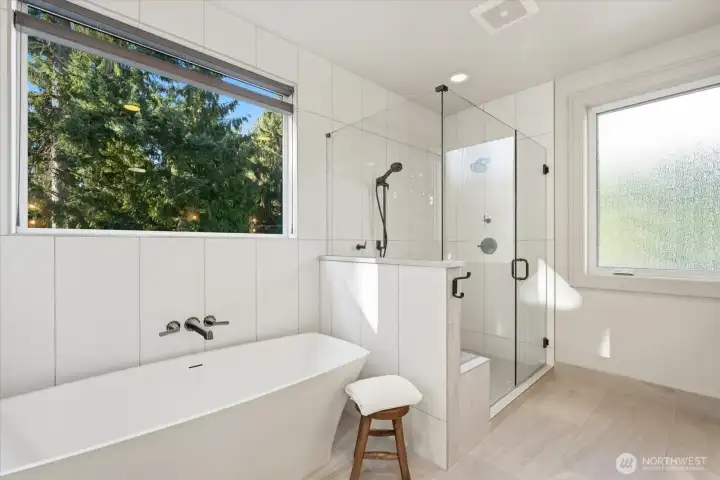 Double headed shower, stand alone soaker tub, radiant in floor heating in Primary Bath