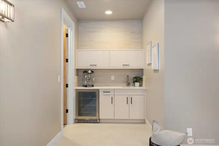 Lower level wet bar flanking the Theatre room and entrance to the Wellness room
