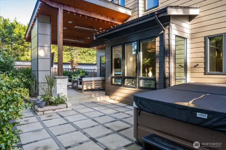 Covered and uncovered patio with Jacuzzi to your right.