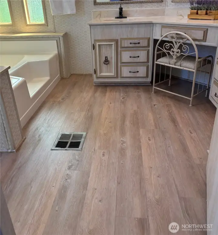 Primary bath with BRAND NEW vinyl plank flooring