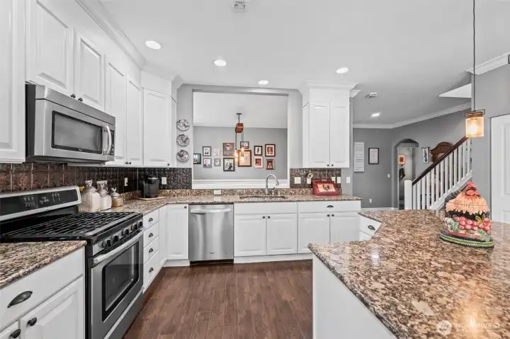 Kitchen opens up to the formal dining room