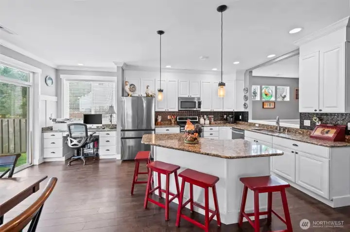 large kitchen island and work station next to sliding door