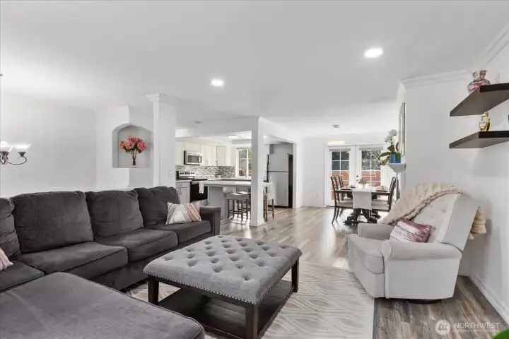 Open concept living room flowing through to the kitchen.