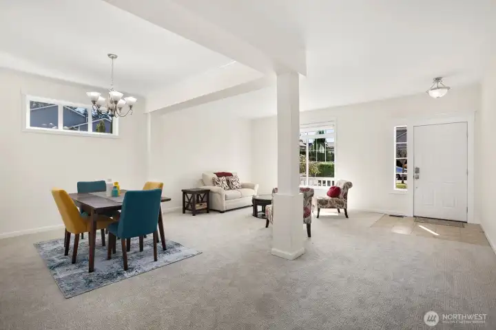 Front door into living room / dining room.  All new carpet throughout - March 2026.  All new paint throughout (ceilings & walls) - March 2026.