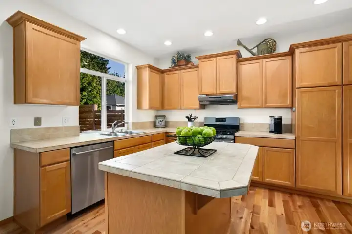 Kitchen with beautifully refinished solid hardwood floors with extremely quiet dishwasher.
