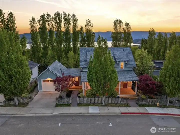 Exterior twilight view of home looking west over Lake Chelan.