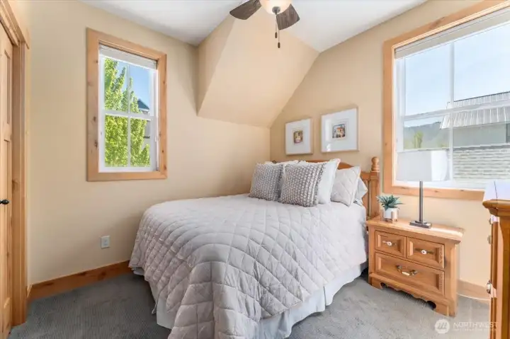 View of upper level guest bedroom with Queen-sized bed.