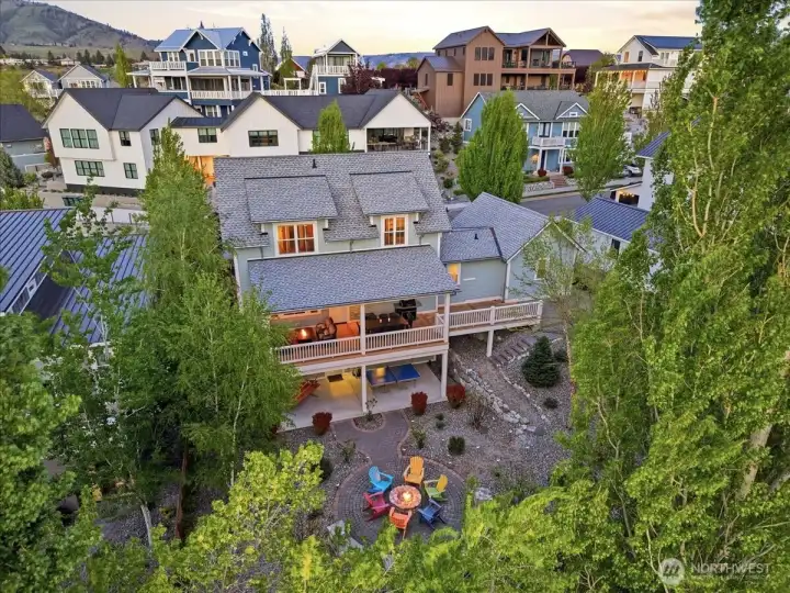 Exterior aerial twilight view of home looking east.