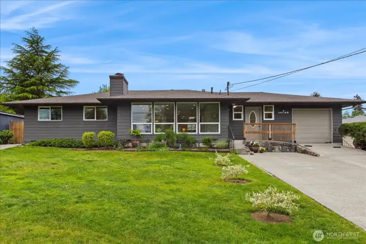 Fantastic rambler with wall of windows in the living room that allow light to flow throughout the main level.  8yr young roof and fresh new exterior paint make this house pop.