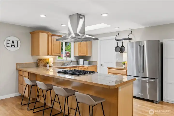 Appreciate plenty of extra seating at the kitchen bar.