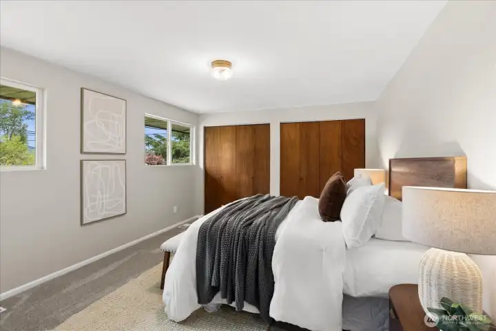 Primary bedroom is spacious and features double closets.