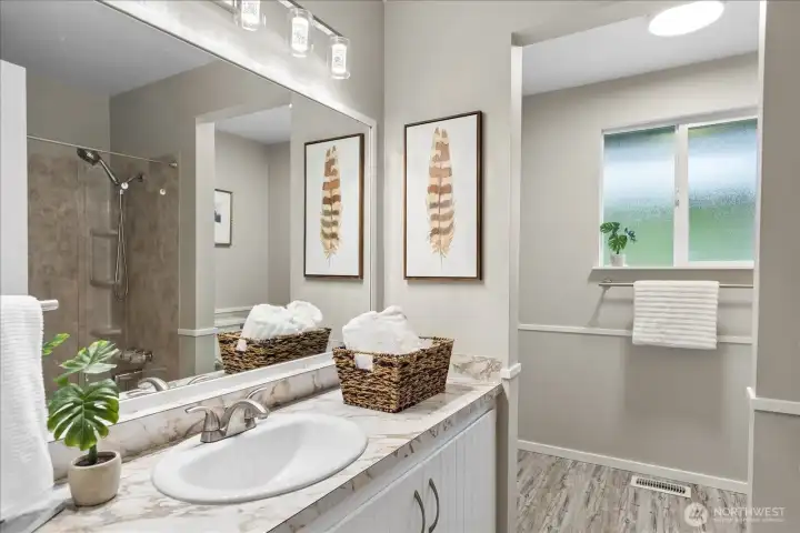 Hall bath in main living is spacious and has a bath/shower combo.