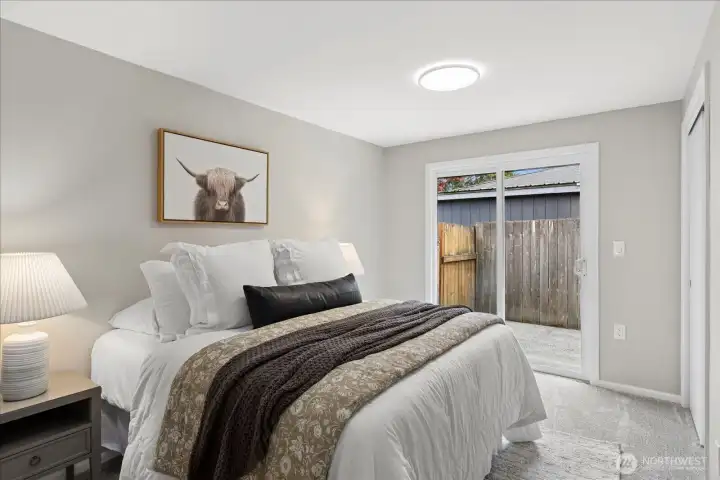 Guest bedroom #3 has access to back deck via slider door.