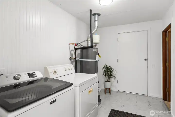 Enjoy doing laundry in this trendy, bead board surround, laundry with updated floors.
