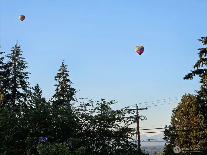 Enjoy watching hot air balloons drift through the air from your front porch!  Also, note the peek-a-boo mountain views.