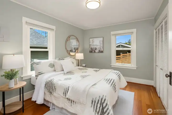 Main floor bedroom is spacious and has plenty of closet space.