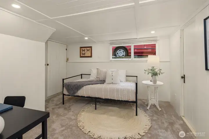 Cute lower bedroom with new ceiling, new lighting, and fresh carpet.