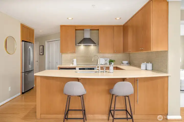 Beech cabinets, plenty of storage space, and chic under-cabinet lighting. Beech cabinets, plenty of storage space, and chic under-cabinet lighting.