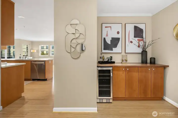 The bar area with wine fridge and TV hookup sits to the right. The bar area with wine fridge and TV hookup sits to the right.