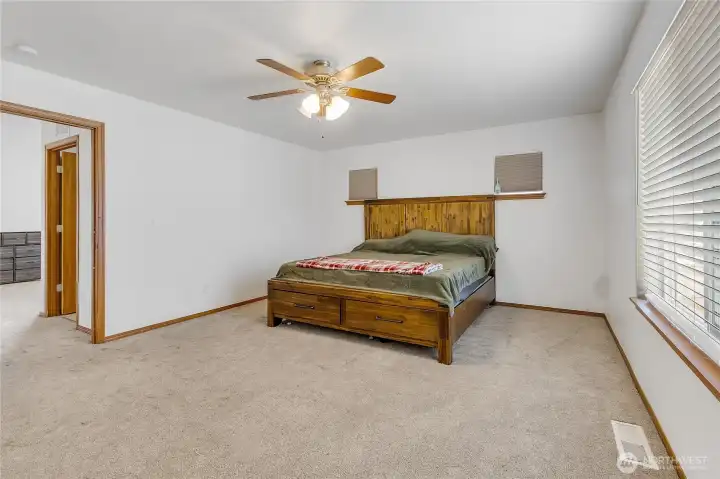 Spacious Primary Suite with ensuite bathroom and large walk-in closet