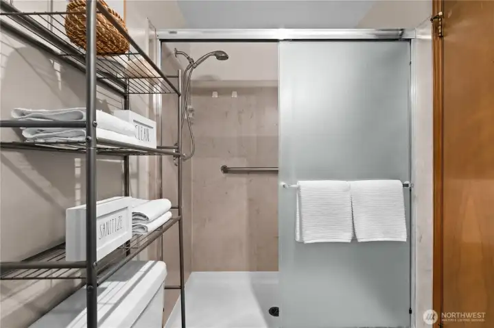 The primary bath features a walk-in shower. The primary bath features a walk-in shower.