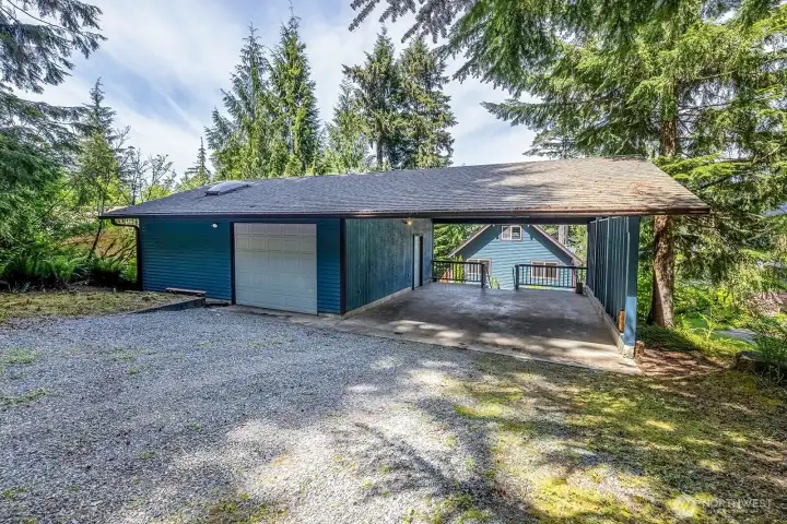 Garage with covered carport.