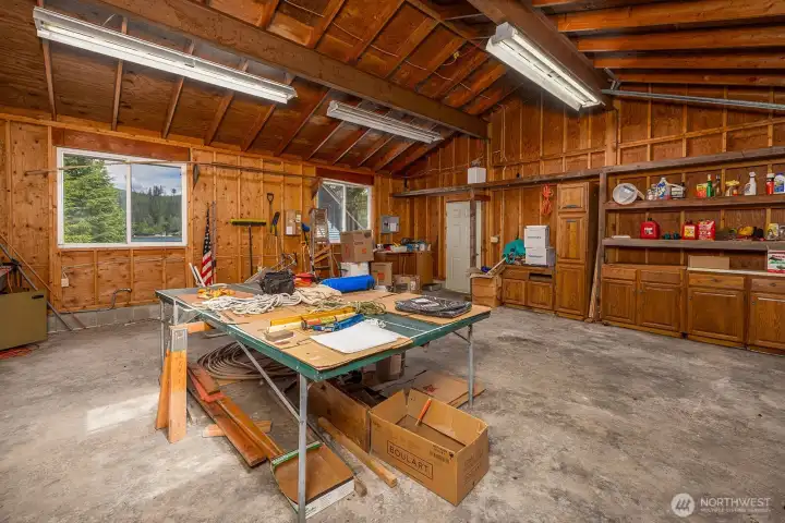 Enclosed garage includes shop space.