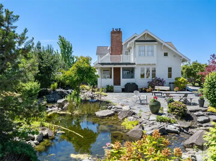 Gorgeous landscaping with pond and waterfall.