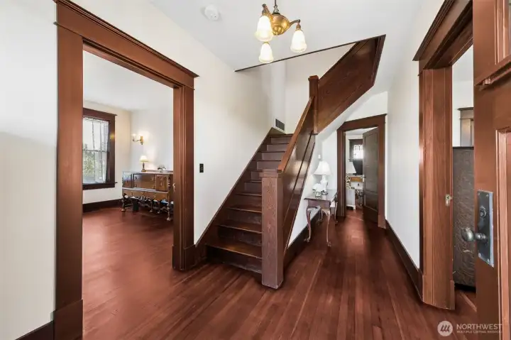 Entry with Dining room to the left, living/music room to the right. Door straight ahead to family room with fireplace.