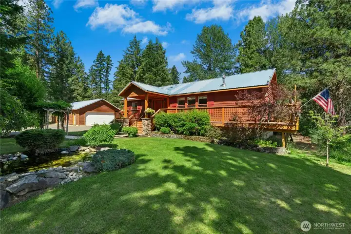 A classic cedar exterior and mature landscaping create a timeless Northwest arrival. A classic cedar exterior and mature landscaping create a timeless Northwest arrival.